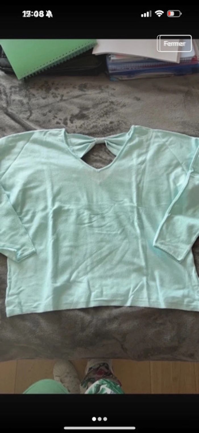 Pull avec noeud en strass