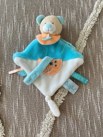 Peluche doudou plat accroche tétine 24cm Babynat ours bleu blanc et orange très bon état