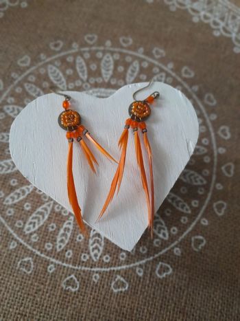 Boucles d oreilles plumes orange