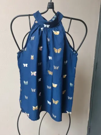 Blouse sans manche avec papillons