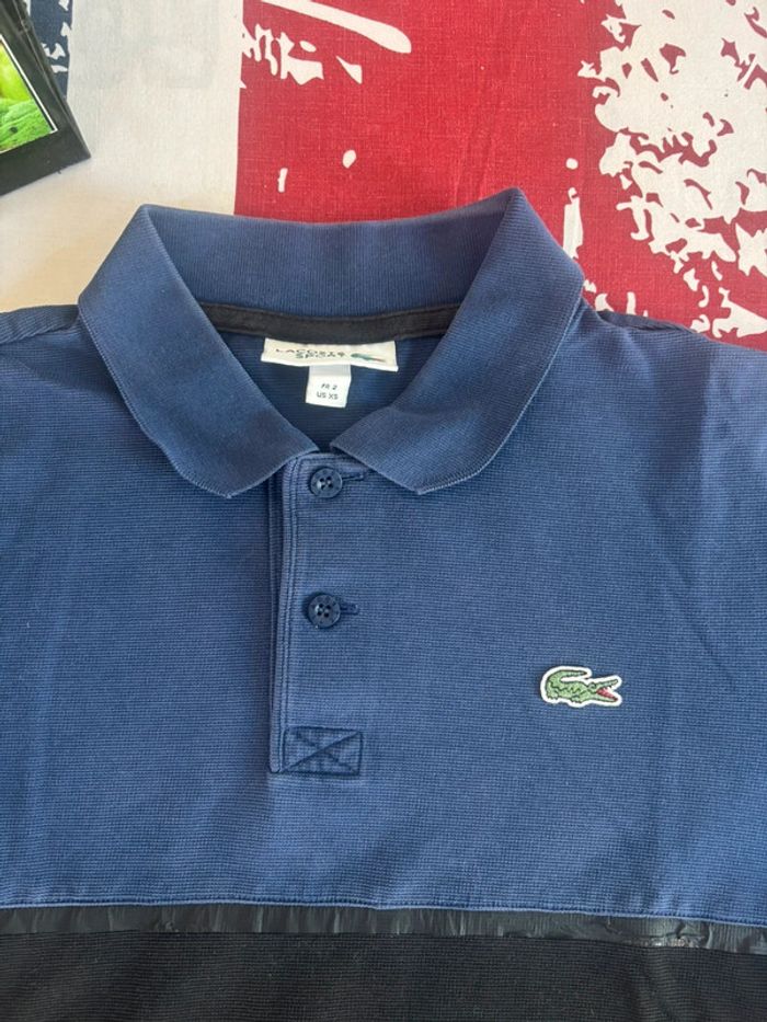 Polo Lacoste taille xs bleu et noir - photo numéro 2
