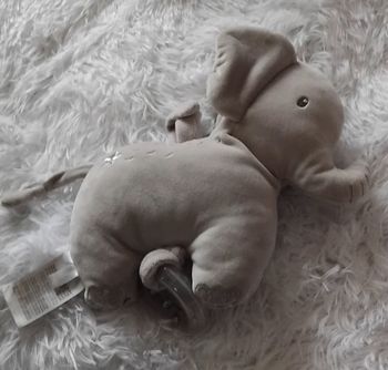 Doudou peluche musical éléphant gris  étoile argenté- anneau - Mots d Enfants
