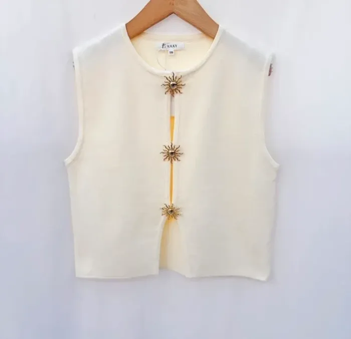Pull haut sans manches beige étoile laine tendance