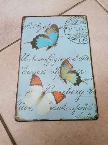 Plaque en métal papillon décoration murale