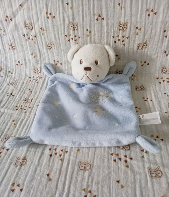 Doudou ours blanc bleu Nicotoy