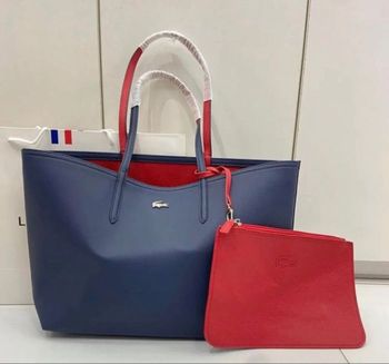 Sac Lacoste réversible bleu marine ou rouge avec pochette parfait pour les étudiants neuf jamais porté