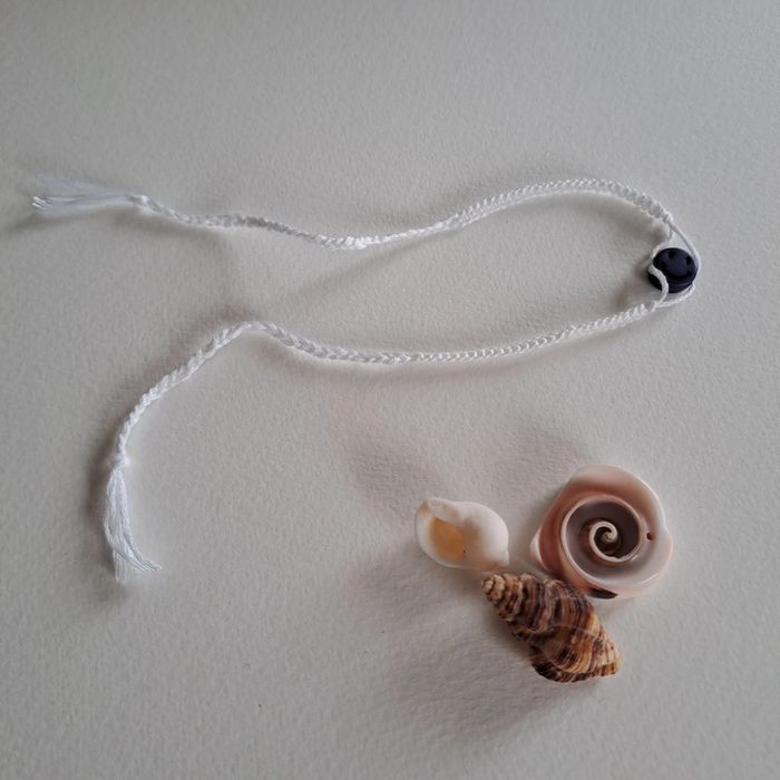 (Réduction) Bracelet blanc avec perle violette - photo numéro 3