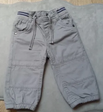 pantalon tape à l'oeil 6 mois gris état comme neuf