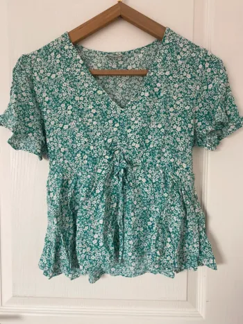 Top peplum fleuris