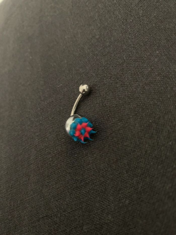 Percing nombril qui s’allume faut juste changer les piles