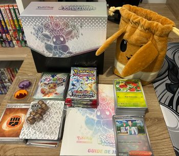 Pokemon ETB évolutions prismatiques ouverte + pochette Evoli + lot de cartes