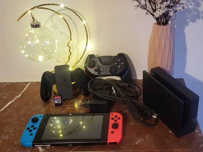 Console Nintendo Switch comme neuve + 1 jeu - photo numéro 2