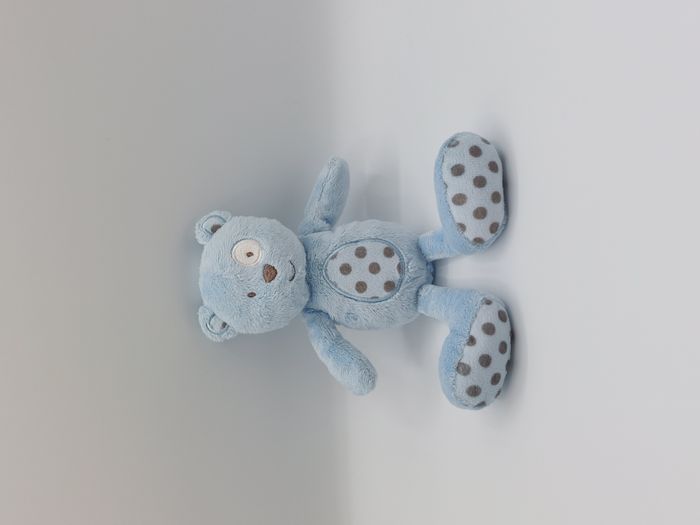 Peluche doudou ours bleu ciel cocard blanc pois noir marron 21 cm FS Baby ?