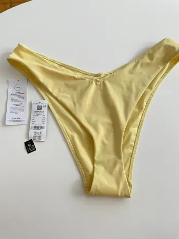 Bas de maillot de bain jaune pale neuf taille 44 Etam