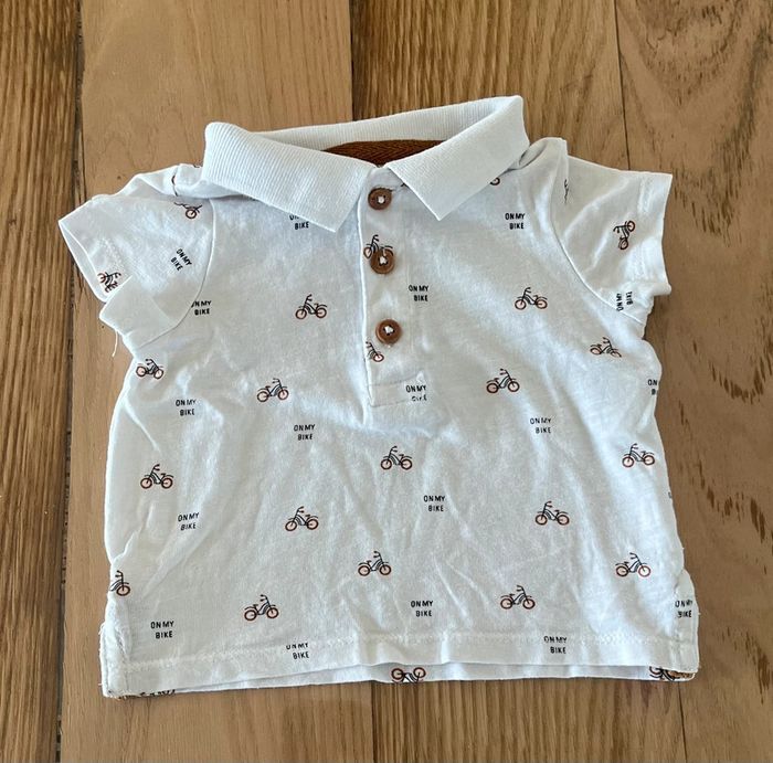 Polo garçon 3 mois – Kiabi – Vélo blanc/marron