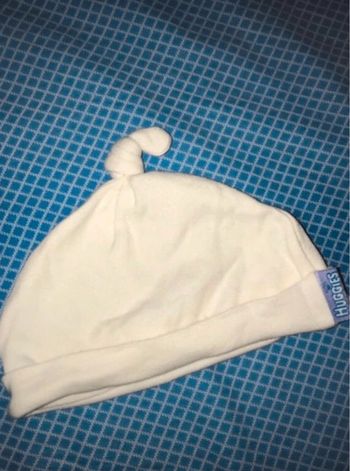 protège tête bébé en coton beige huggies très bon état