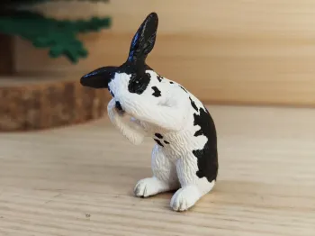 Schleich lapin assis noir et blanc Figurine Animal de la ferme