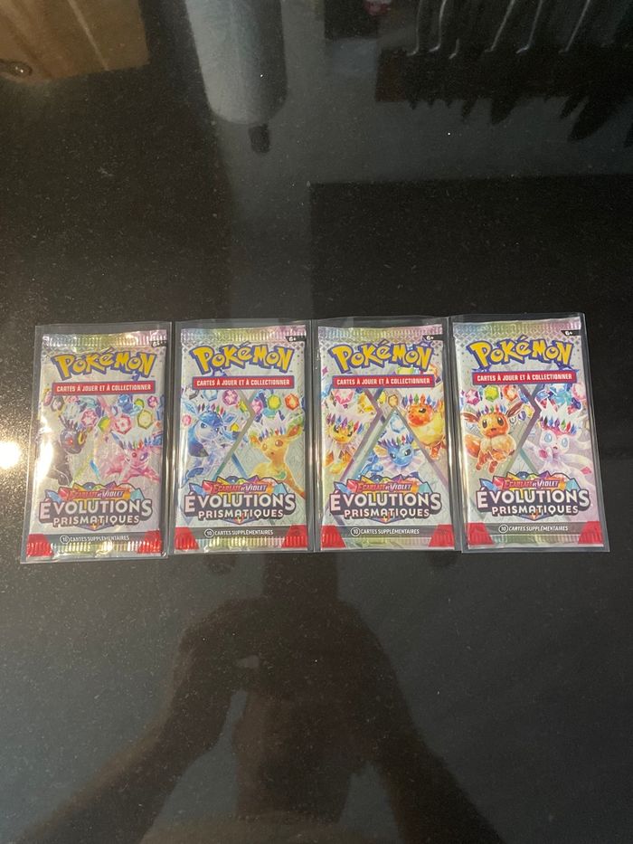 Neuf Artset 4 boosters Pokemon 8.5 évolutions prismatique