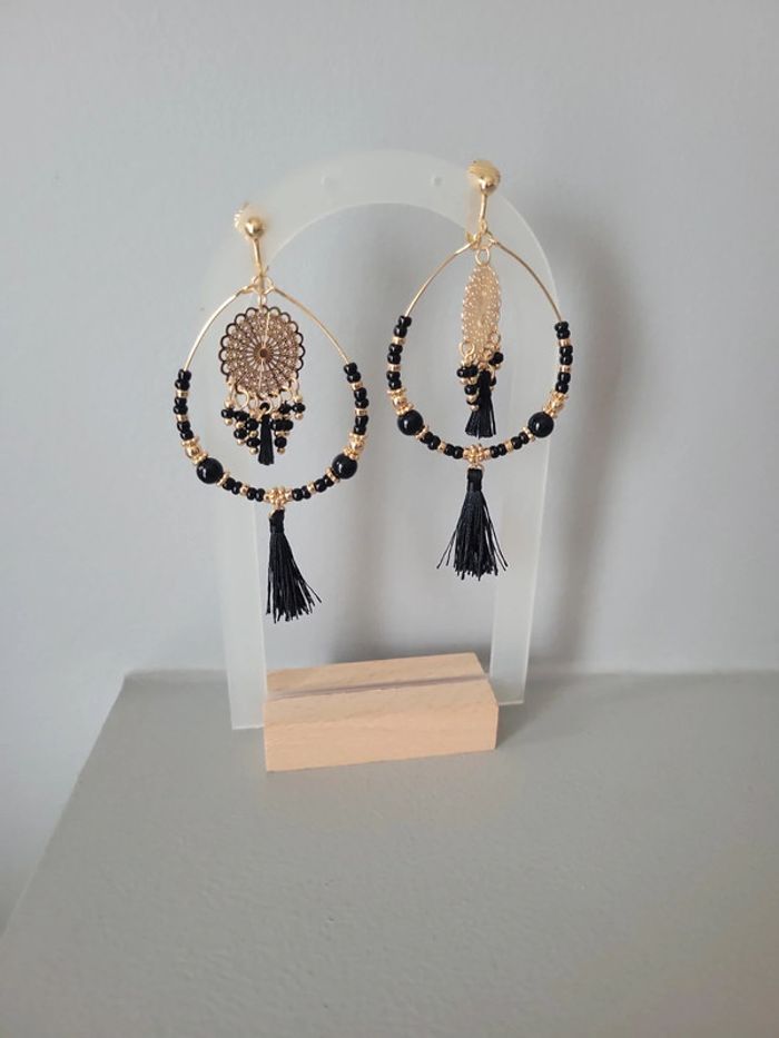 Clips "attrape rêves " acier gold et noir.