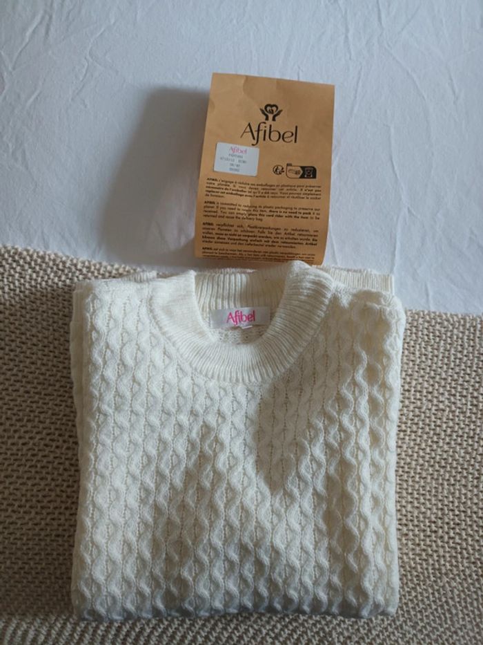 Pull chaud court col montant maille épaisse
Ecru