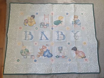 Dessus de lit ou tapis de jeu