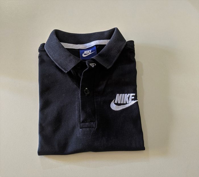 Polo Noir Nike taille S 8 ans Mixte