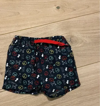 Short noir à motifs orchestra taille 6 mois