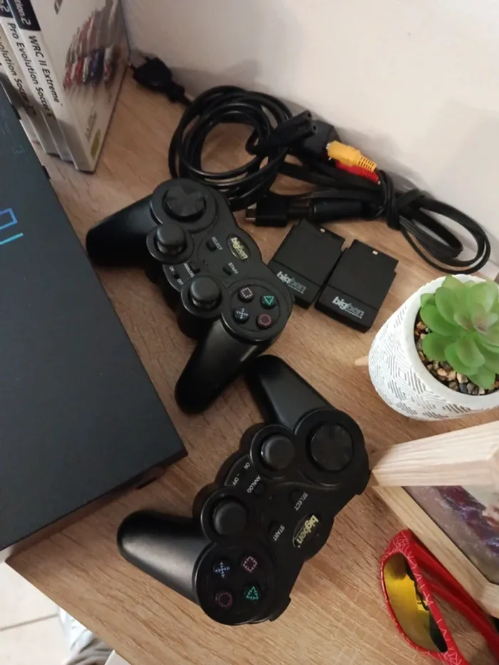 PS2 fat avec 2 manettes et 4 jeux. - photo numéro 3