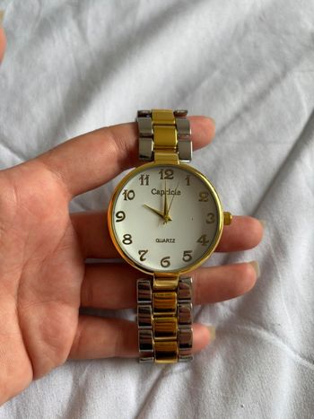 Montre Capricie unisexe – cadran blanc – bracelet or/argent rond – acier inoxydable