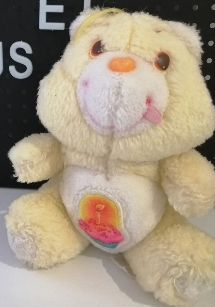 peluche bisounours jaune gros gâteau  vintage car bears