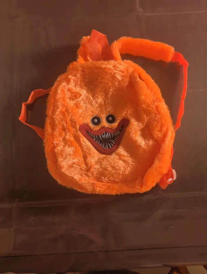 Sac a dos orange monstre