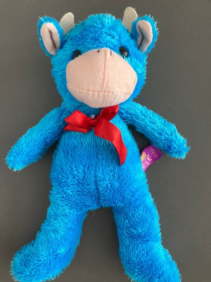 Peluche vache bleu en très bon état