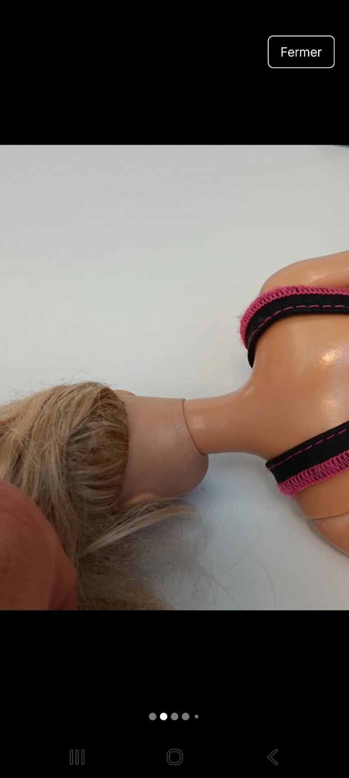 Poupée mattel barbie tenue fushia et noir tête 1998 corp 2013 
Poupée et ensemble compris - photo numéro 2