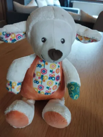 Doudou musical chien. Hauteur 20 cm