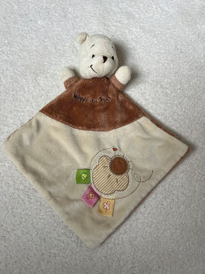Doudou plat Winnie l’Ourson Disney Baby