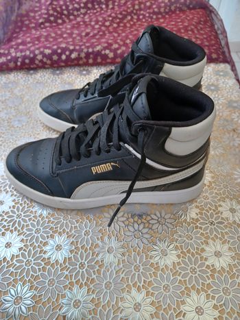Baskets montantes Puma coloris noir et blanc taille 37 en bon état.