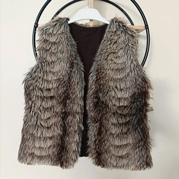 10 ans gilet sans manche ( vendu sans ceinture comme sur la photo)