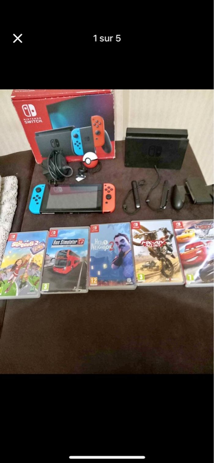 Nintendo switch  parfait état avec 5 jeux.