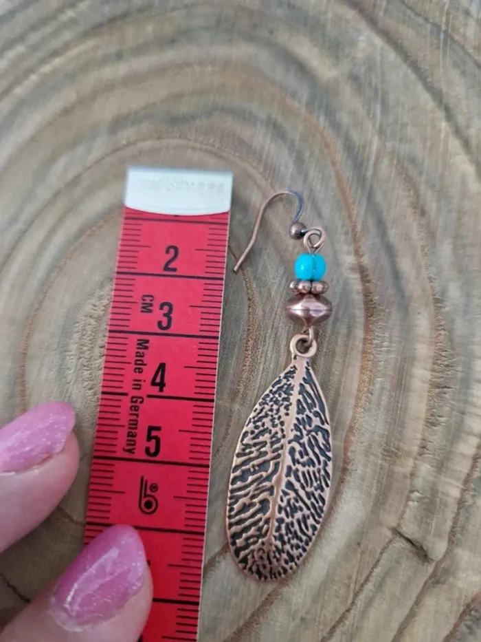 Boucles d'oreilles fantaisies couleur bronze plume - photo numéro 2