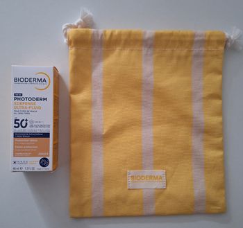Crème solaire et sa pochette en tissu