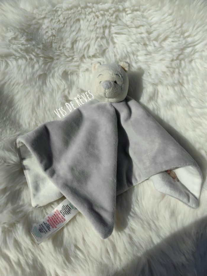 Doudou Winnie L'ourson jaune clair et gris Disney