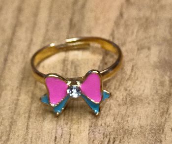 Bague neuve acier réglable motif noeud rose et bleu petit diamant