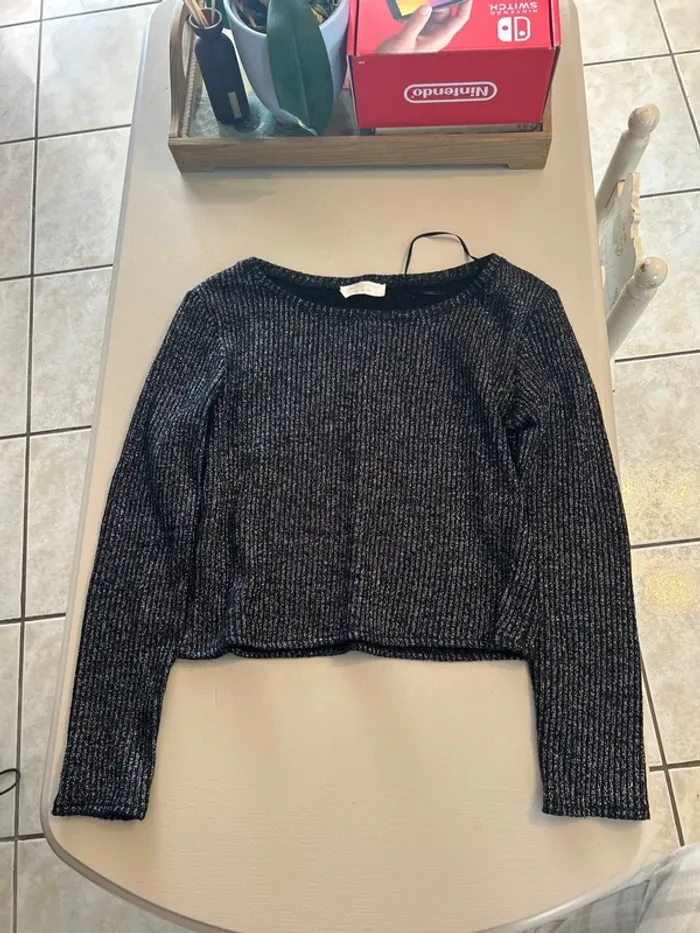 Pull noir brillant cache cache