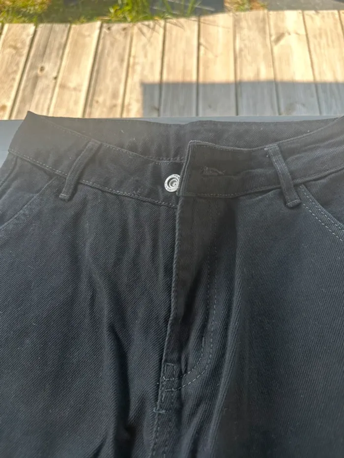 Jean large noir avec poche sur le côté - photo numéro 3