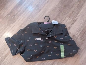 Polo dinosaure neuf 13/14 ans