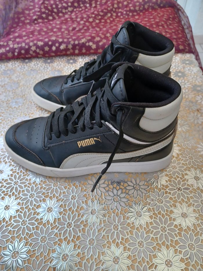 Baskets montantes Puma coloris noir et blanc taille 37 en bon état.