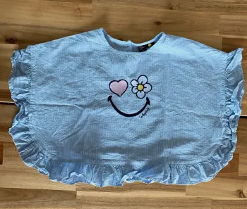 Top large Smiley world bleu rayé blanc