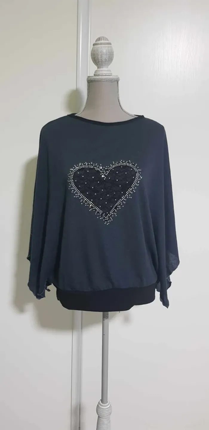 Pull manches ouvertes