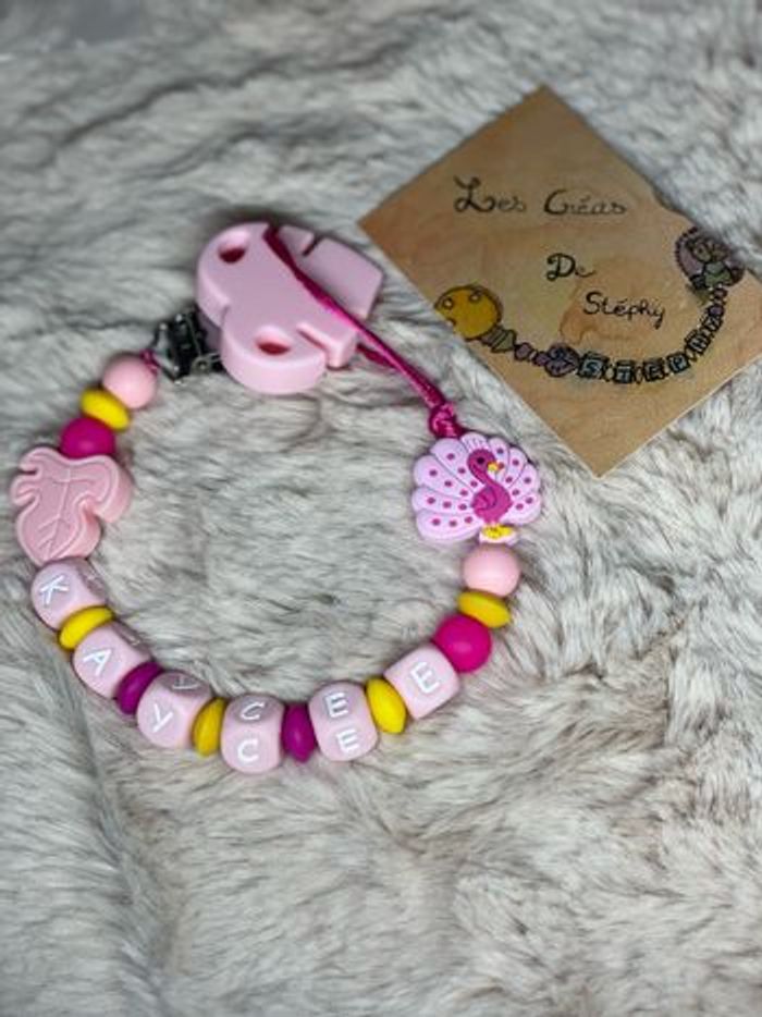 Attache tétine  paon