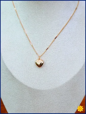 Collier cœur doré tendance romantique été 2025